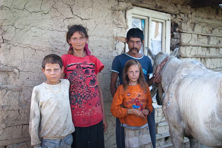 Gipsy family with white horse